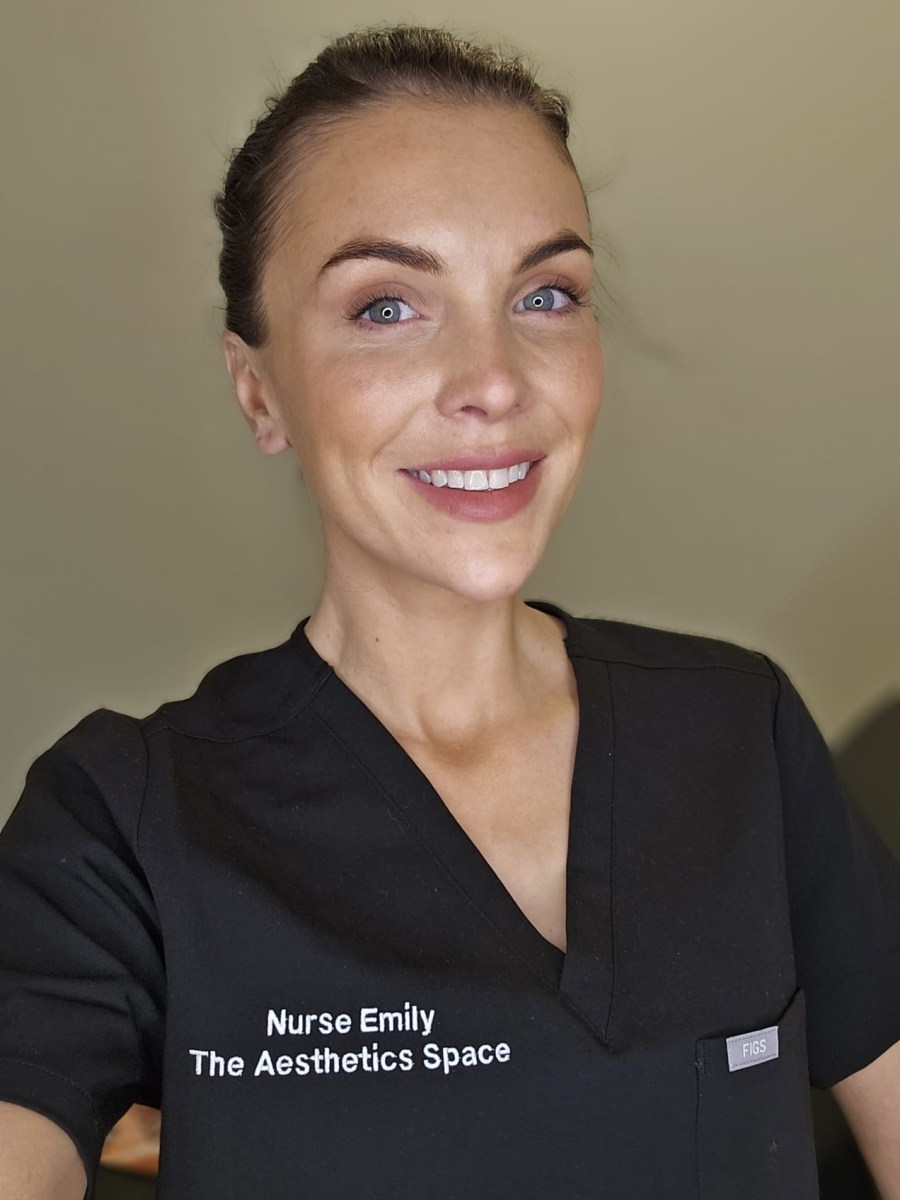 Nurse Emily, founder of The Aesthetics Space, in her clinic uniform